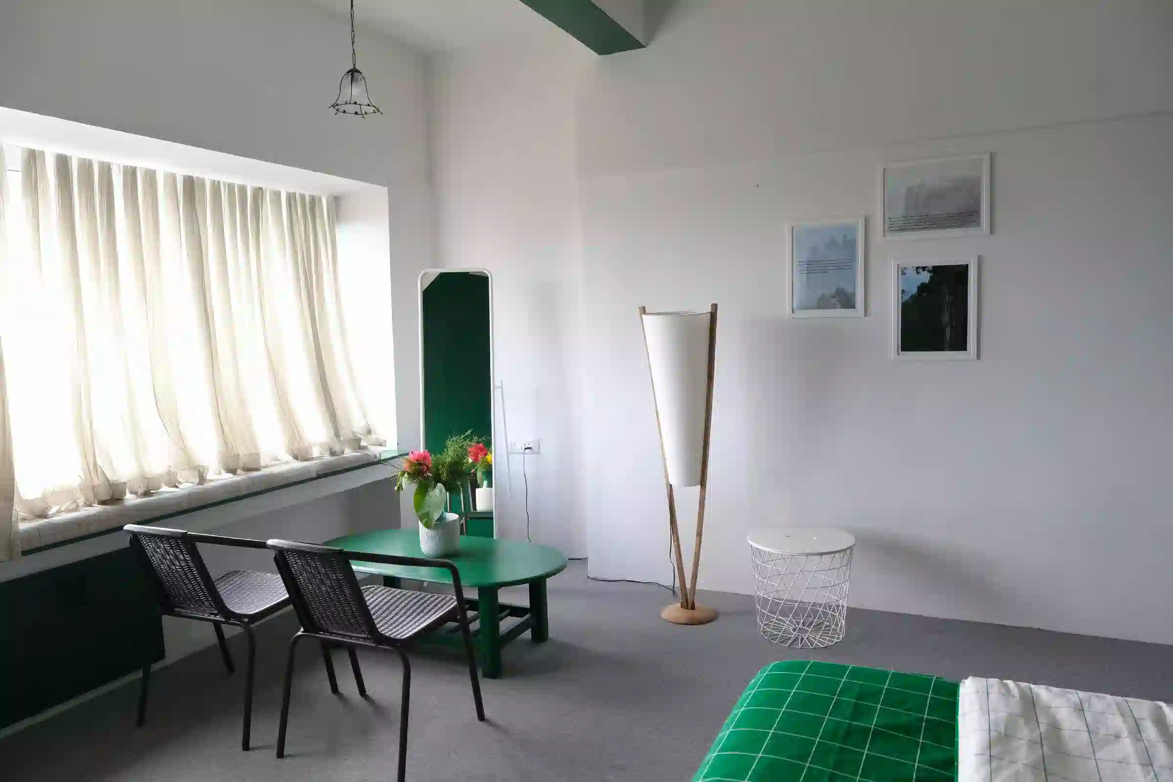 Comfortable living area with green interiors at Cardamom Pods, Kodaikanal